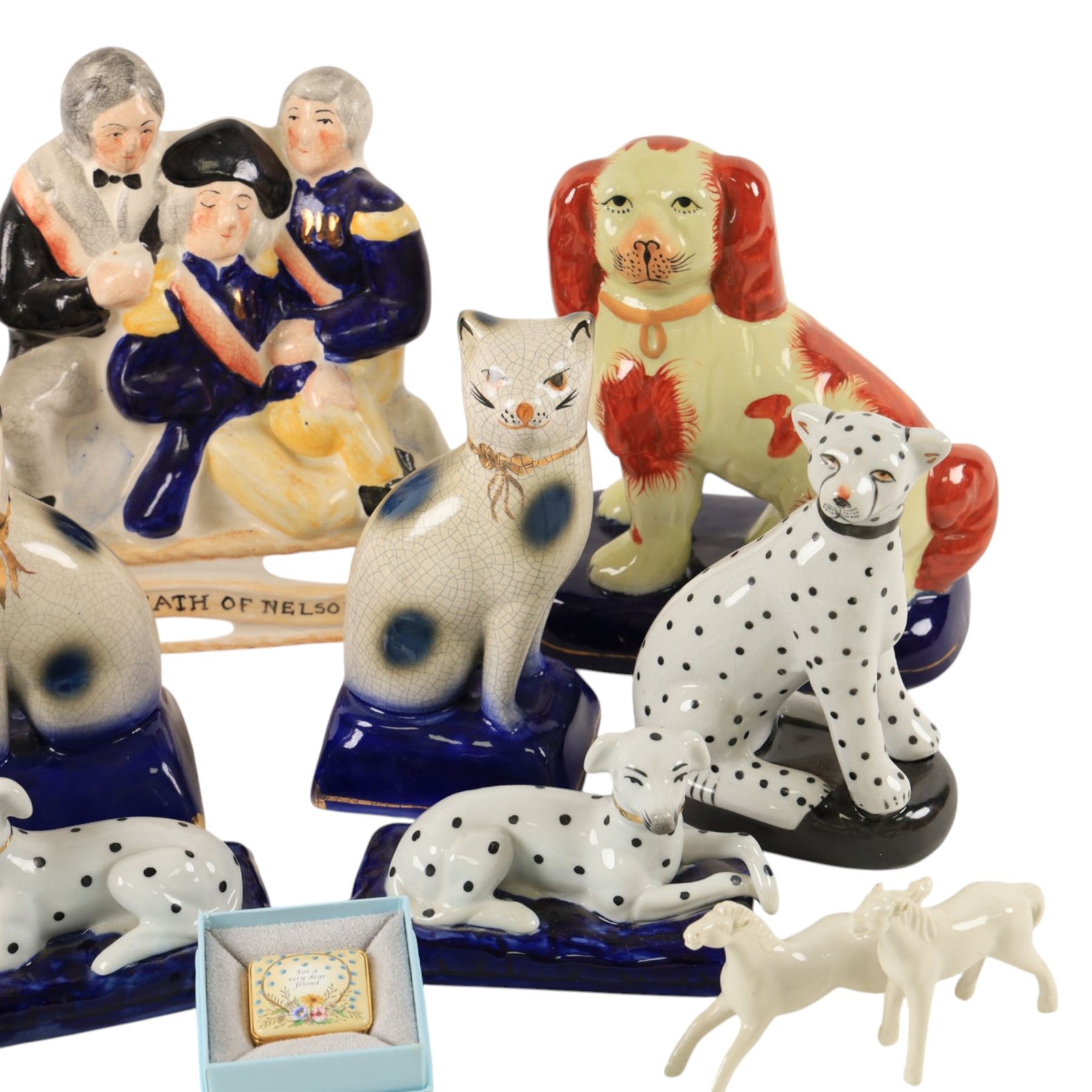 Collection of Staffordshire style figures, including dogs, cats, Death of Nelson etc 