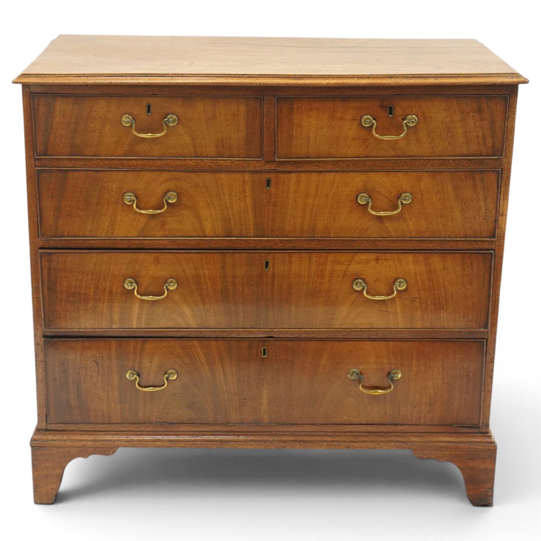 George III mahogany straight-front chest, rectangular top with moulded edge, over two short and three long graduating cock-beaded drawers, each with original brass swan neck handles, lower moulded edge on bracket feet