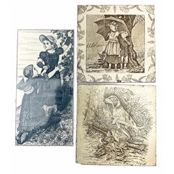 Maw & Co tile depicting a blue and white scene of two young girls picking fruit, together with two Josiah Wedgwood & Sons Etruria tiles, one decorated with a young girl and boy under an umbrella 'April', the other decorated with a hunting scene. (3).
