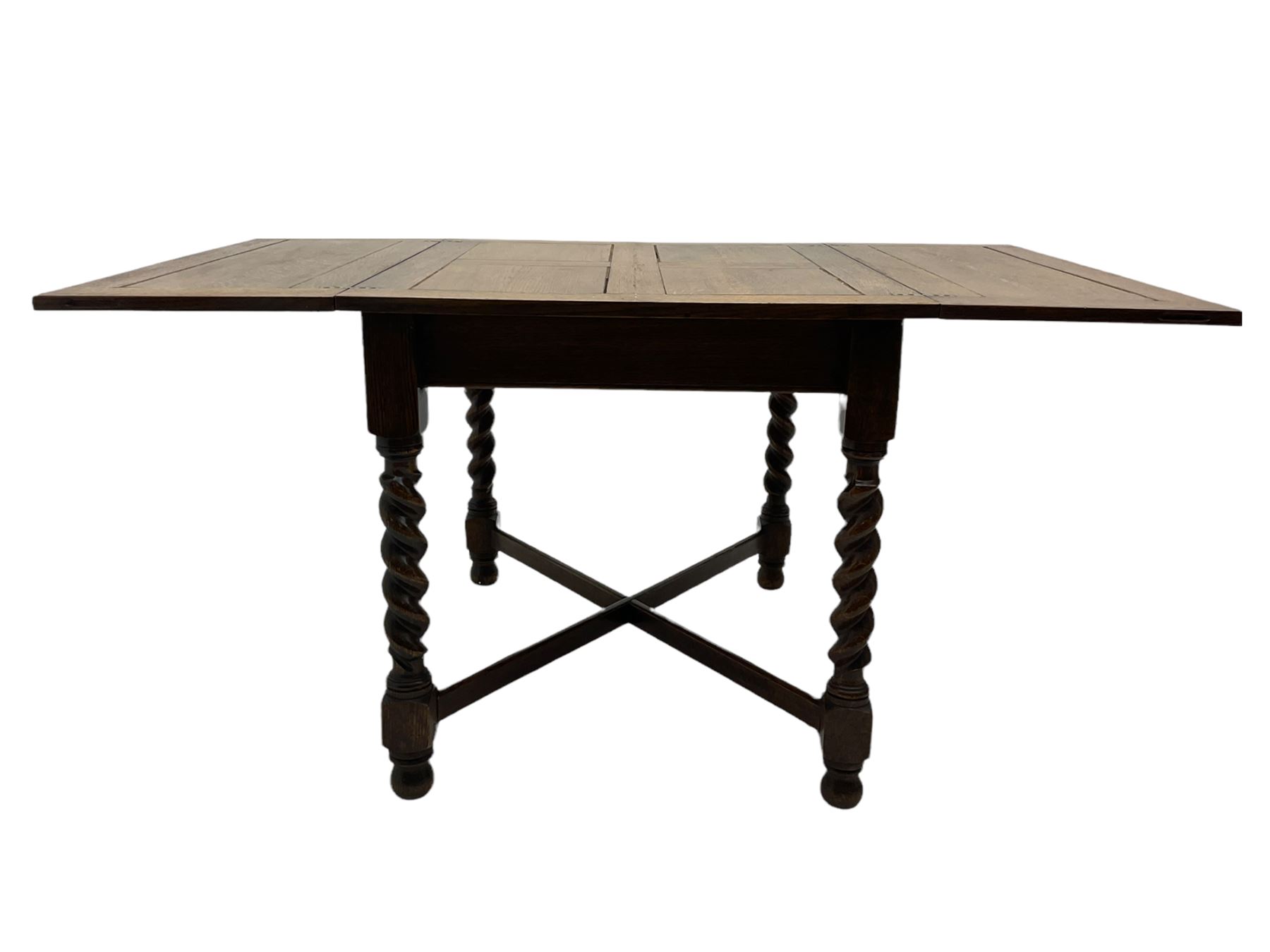Early 20th century oak barley twist extending table, two fold-over leaves with pull-out stays, spiral turned supports joined by x-stretchers