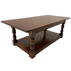 Rectangular medium oak coffee table, turned supports joined by undertier 