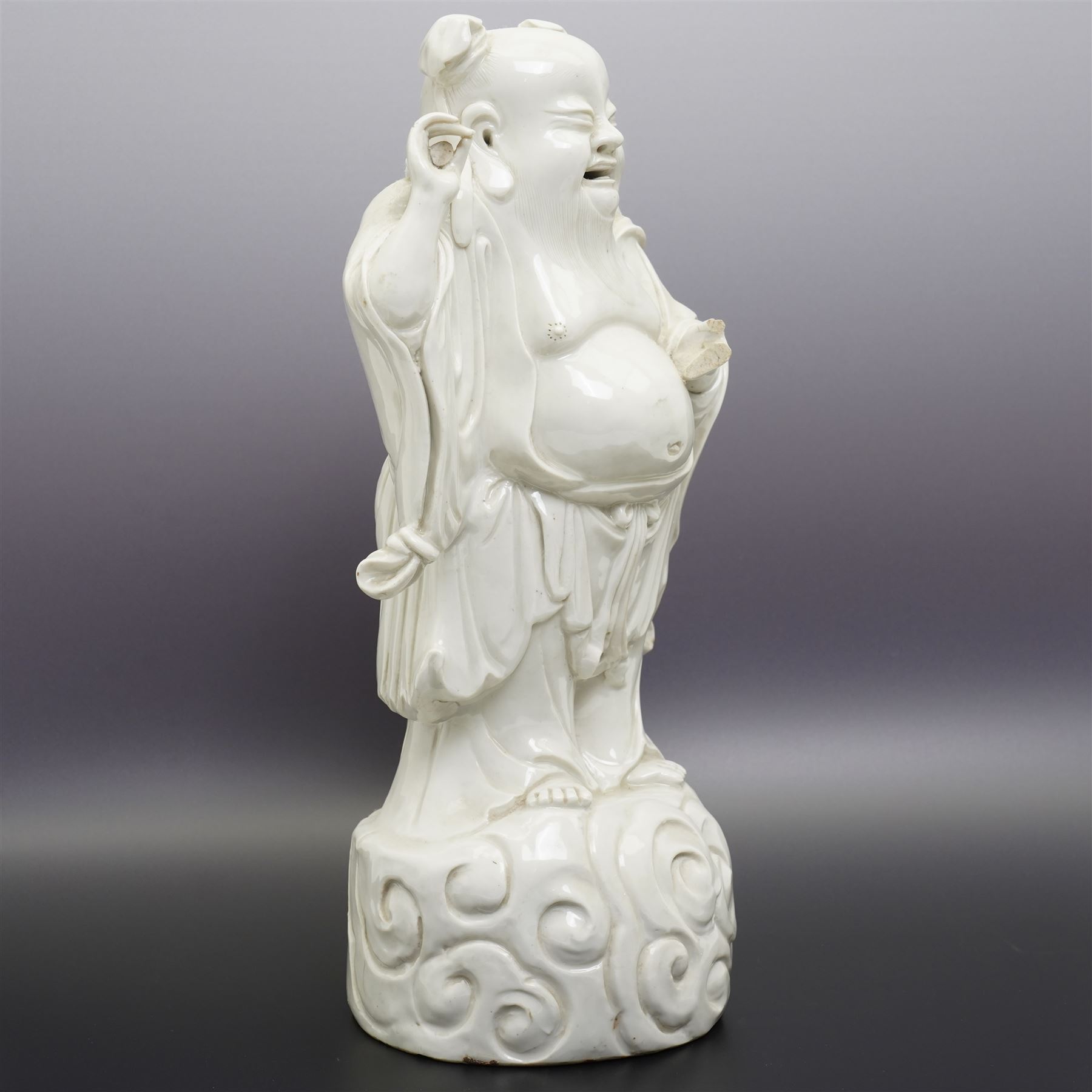 Chinese blanc de chine figure of Shou Lao, standing upon a cloud, H36cm 