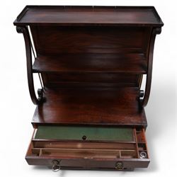 Regency mahogany lyre chiffonier, tall two-tier raised back with serpentine supports and brass pillars, the drawer fitted with sliding writing surface with divisions and pen and ink stands, seven internal drawers with lion mask handles enclosed by panelled doors, inlaid with ebony stringing
