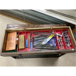 Six shelved cabinets for displaying ‘00’ gauge locomotives comprising plain plywood and white painted examples with track applied to various shelves, largest H63cm, W107cm, D27cm; Collection of tools for building model locomotives to include Weller PU-2D Soldering Pencil and Standard Tip Soldering Iron 20W/230V, Humbrol Modellers Airbrush, Power Supply Units and two wooden chests one of which housing a collection of tools including tweezers, scalping tools, wrenches etc 