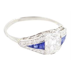 Platinum diamond and sapphire ring, the principal old cushion cut diamond of approx 1.50 carat, each side set with three graduating calibre cut sapphires and old cut diamond surround