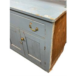 Large 19th century painted pine dresser, raised open three-tier plate rack with waterfall end supports, rectangular top over two drawers and two double cupboards, enclosed by four panelled doors, in distressed blue paint finish 