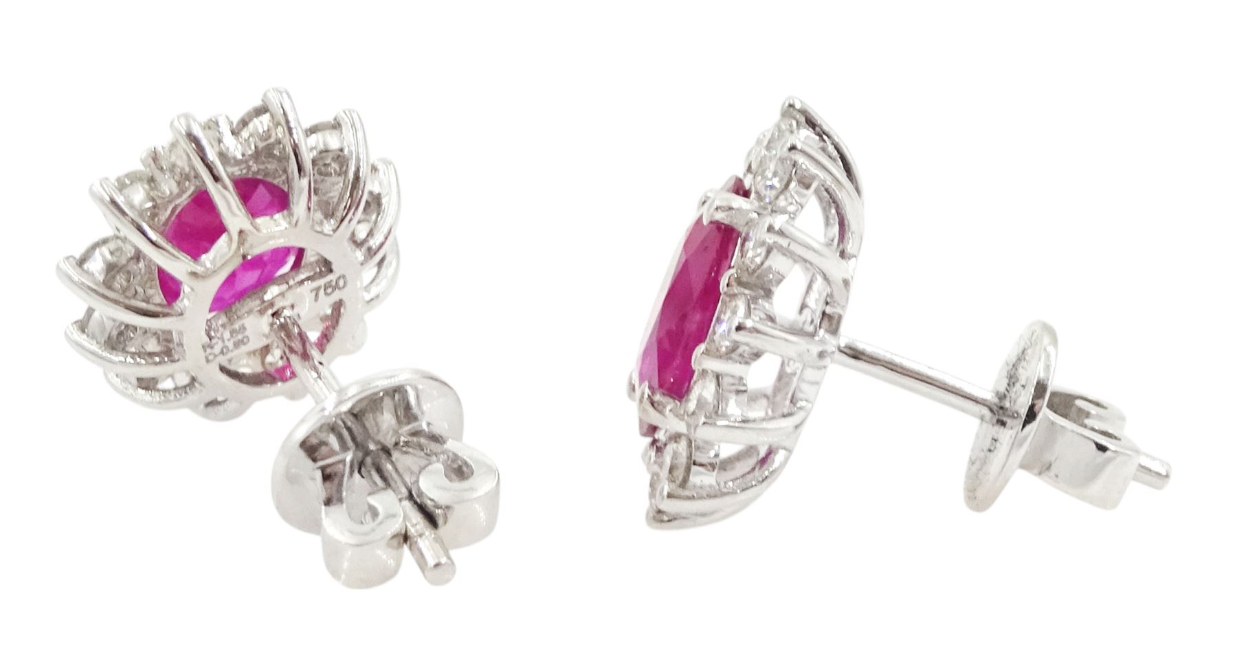 Pair of 18ct white gold oval cut ruby and round brilliant cut diamond stud earrings, stamped, total ruby weight 1.85 carat, total diamond weight 0.50 carat