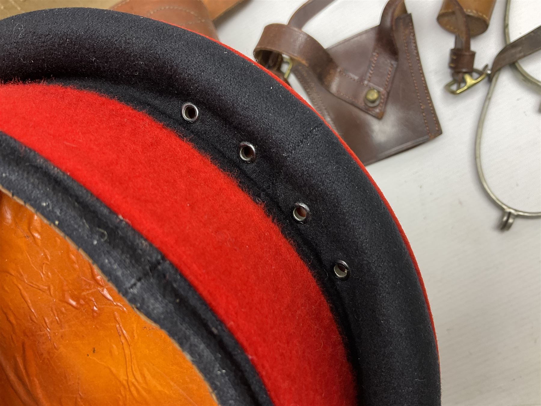 British Army General Staff officer's peaked cap by Herbert Johnson London in Moss Bros. delivery box; two officer's Sam Browne leather belts; leather pistol holster and sword hanger; pair of leather gloves and pair of spurs