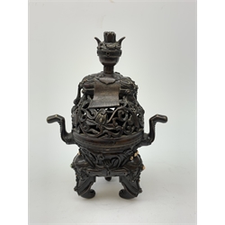 Chinese bronze 'Elephant' censer and cover, of tripod form cast with elephant handles and feet, the trappings inlaid with hardstone cabochons, the pierced domed cover set with a sleeping elephant supporting a basket filled with precious objects, with impressed Ming type seal to base, H26.5cm 
