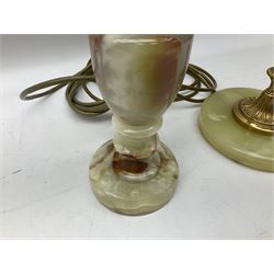  20th century gilt metal and onyx four branched candelabra upon a circular base, and onyx table lamp in the form of an urn, tallest example H48cm