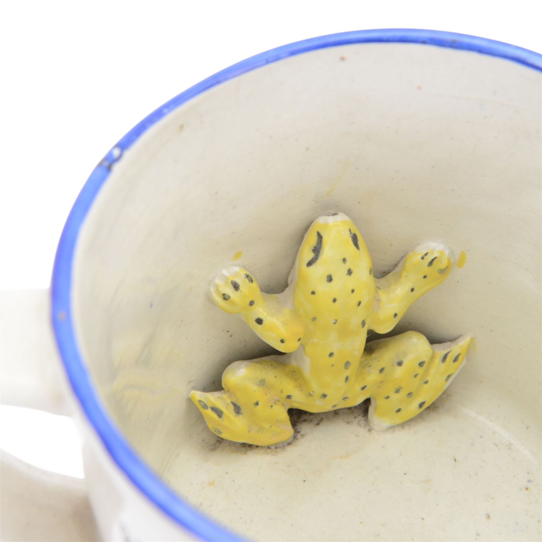 19th century frog and newt cup, decorated with a house in a landscape and cows, featuring a frog and newt inside the cup, together with three other frog cups 