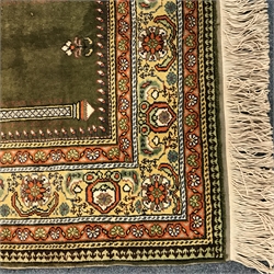  20th century green ground prayer rug, 140cm x 88cm  