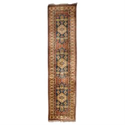 Caucasian hand-knotted runner, dark navy ground with three ivory geometric medallions surr...