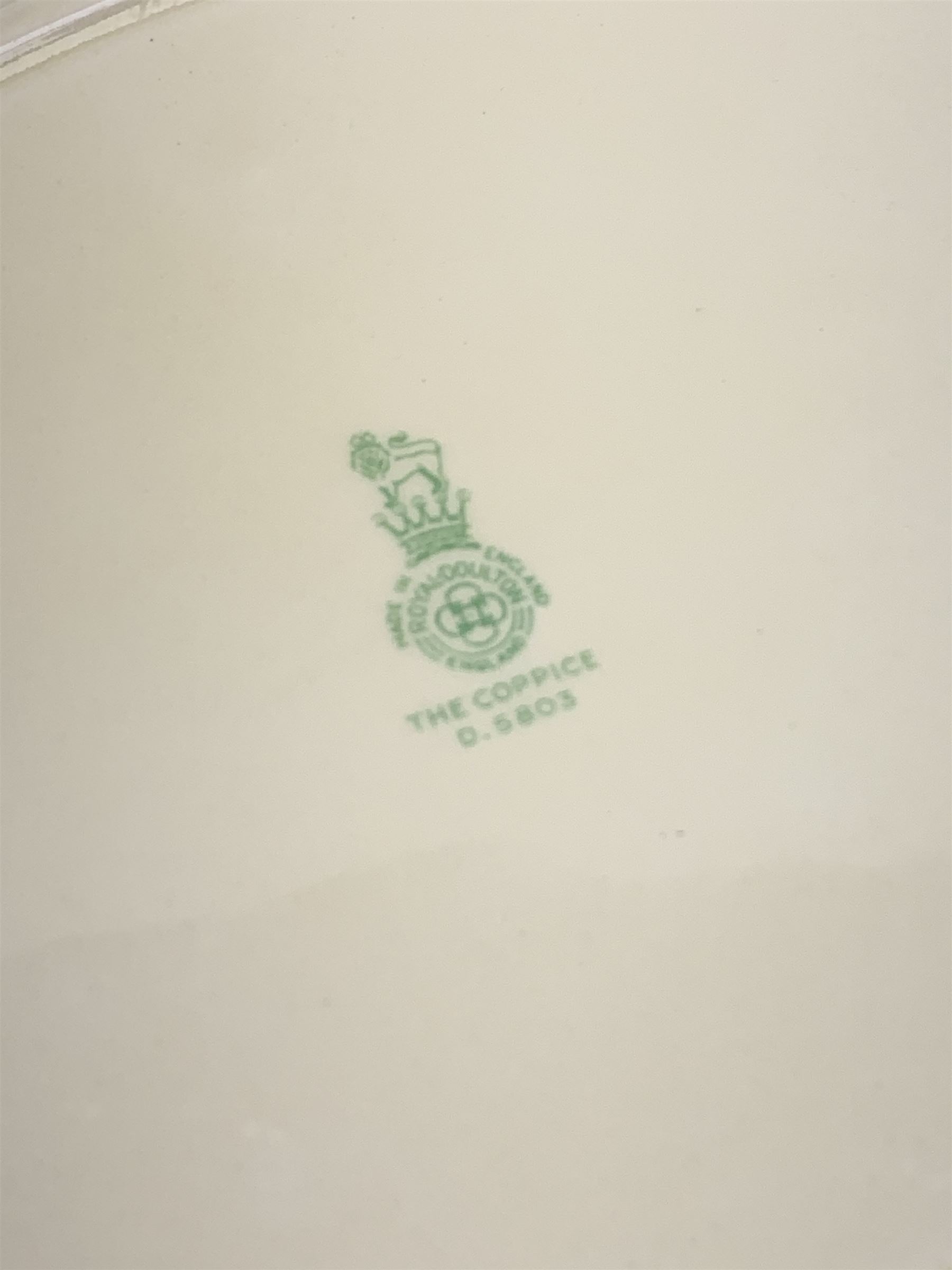 Royal Doulton The Coppice pattern dinner wares, comprising four dinner plates, three salad plates, two large bowls, three smaller, seven side plates, tureen and cover, two oval serving platters, sandwich plate, jug, three tea cups and six saucers, open sucrier, and three egg cups, together with two pieces of  Hartley Greens & Co, Leeds Pottery. 