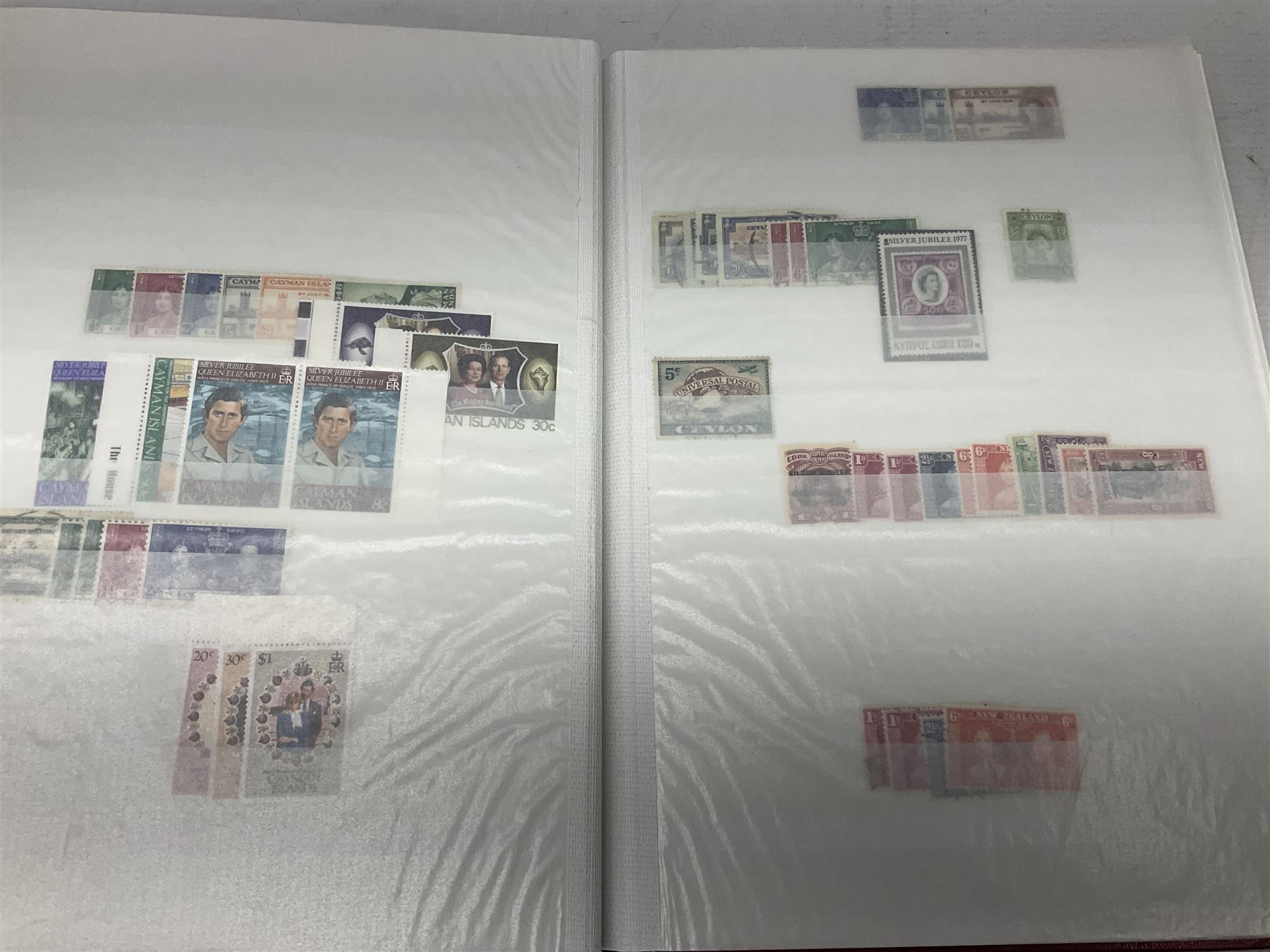 King George V Silver Jubilee stamps 1910-1935 including Bermuda marginal mint block of four, Virgin Islands marginal mint blocks of four including variations/errors, other similar blocks of four etc, various Royal Silver Wedding 1948 stamps, King George VI Victory 8th June 1946, Queen Elizabeth II Coronation etc, housed in a stockbook