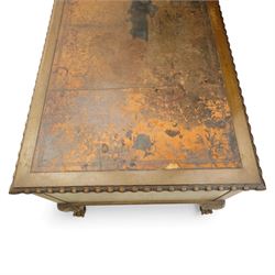 Waring & Gillow - Early 20th century mahogany desk, the leather-inset top above a shaped kneehole, central compartmented frieze drawer flanked by twin banks of of three drawers, each with brass handles, raised on cabriole legs with carved ball and claw feet (Height from floor to underside 62cm)