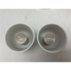 Two Lladro figures, comprising Conductor no 5196 and Prayerful Moment no 5500 together with a Lladro plaque and two Lladro candle holders, Dolphins at Play no 17666 and Sailing the Seas no 17665, all with original boxes, largest example H33cm 