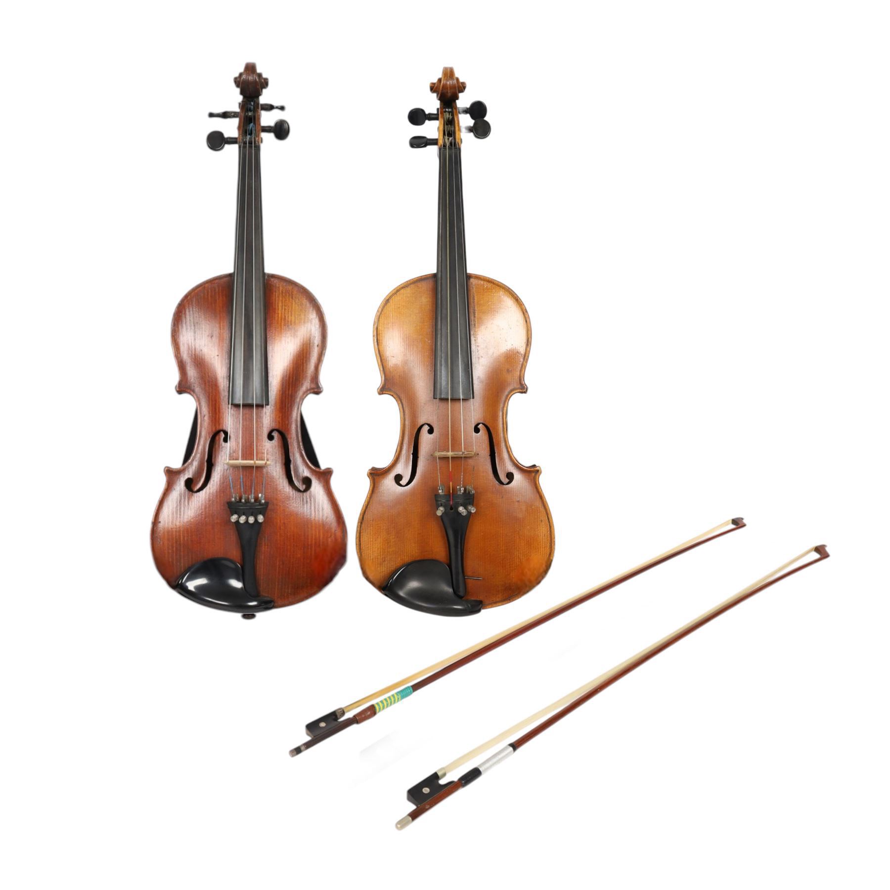 Two 19th century violins, each with two piece maple backs, ebonised wooden pegs and finger boards and modern plastic chin rests, with two bows, all contained within a modern two-violin soft case with red interior