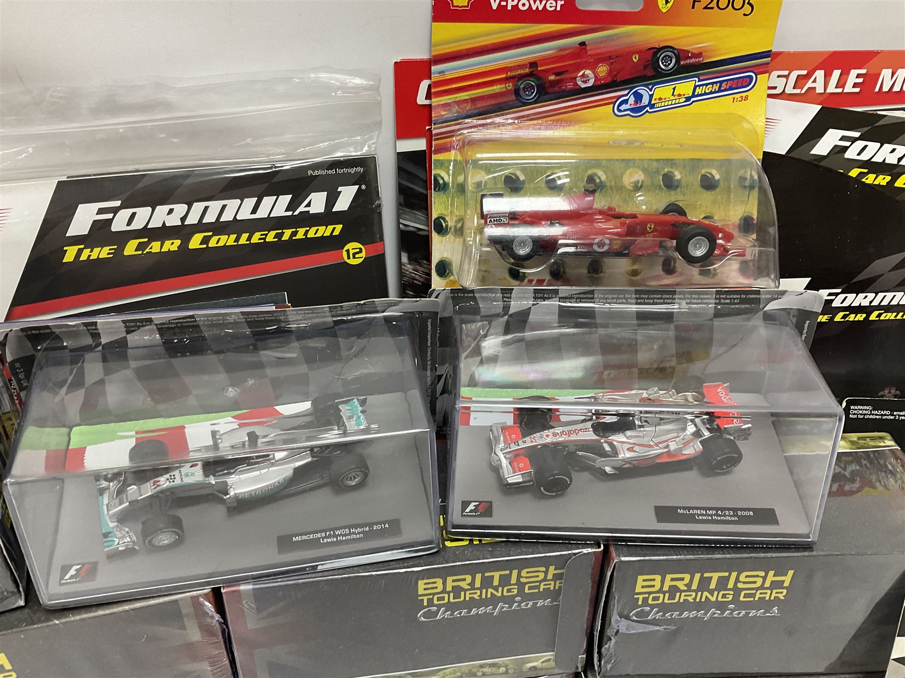 Panini Formula 1 The Car Collection - twelve blister packed racing cars and quantity of periodicals; nine mostly unopened Atlas Editions British Touring Car Champions; and six other boxed/blister packed die-cast models of racing cars