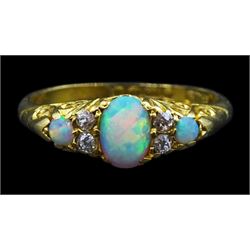 Edwardian 18ct gold three stone opal ring, with four diamond accents set between, Birmingham 1901
