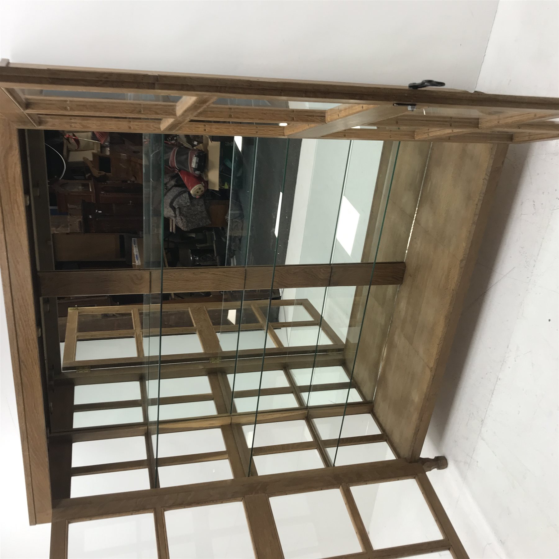 'Foxman' large oak and glazed display cabinet, two doors enclosing three glass shelves and mirrored back, by Don Craven of Oldstead, Thirsk, W154cm, H169cm, D47cm
