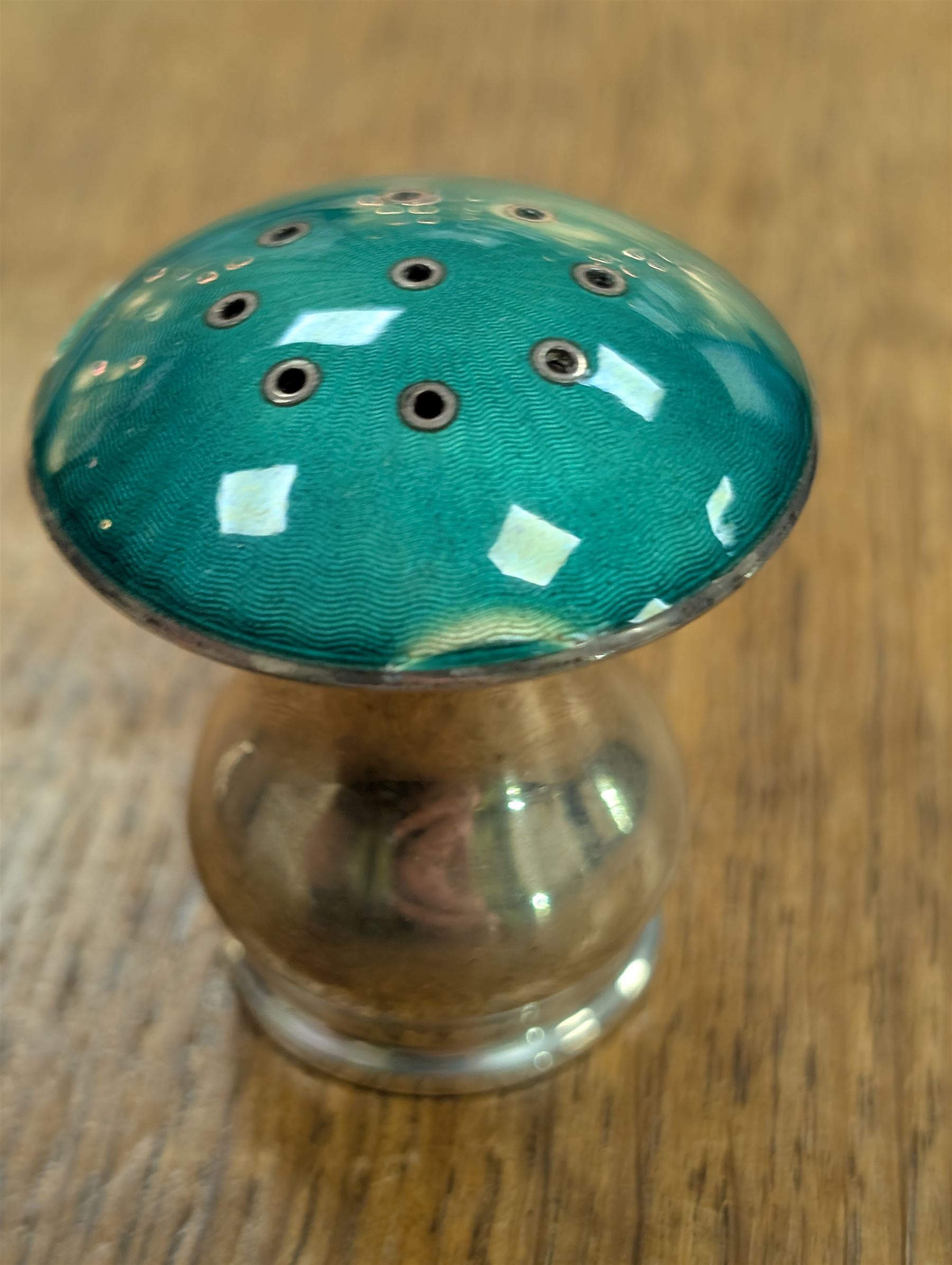 Pair of Norwegian silver and enamel salt and pepper shakers, modelled as toadstools with green guilloche enamel covers, stamped 925S Sterling Norway, H4cm