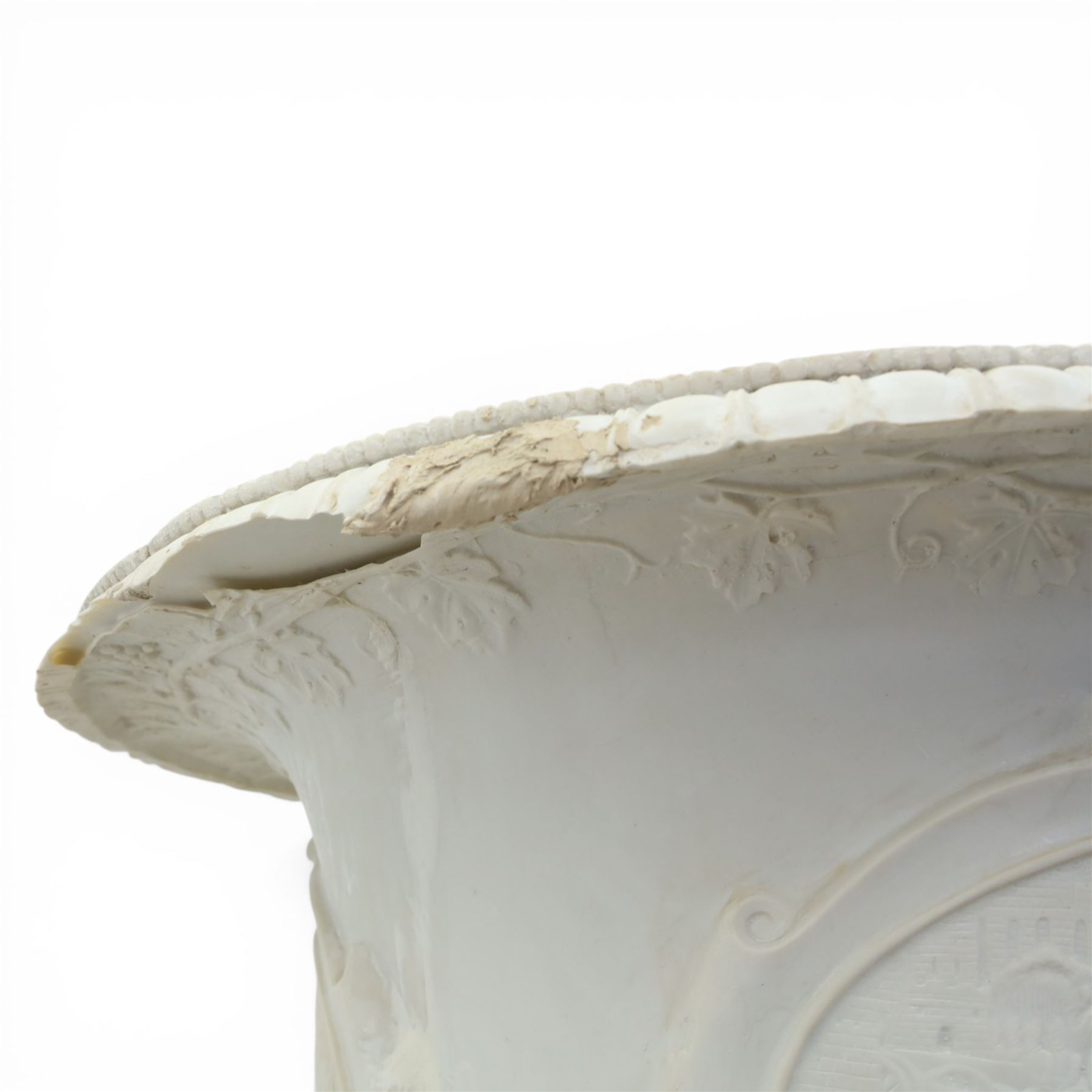 Pair of composite campana urns on stands, the urns decorated with relief figural panels and foliate bands with scrolling handles, on circular socles, the pedestals of square tapering form with moulded edges and applied classical motifs