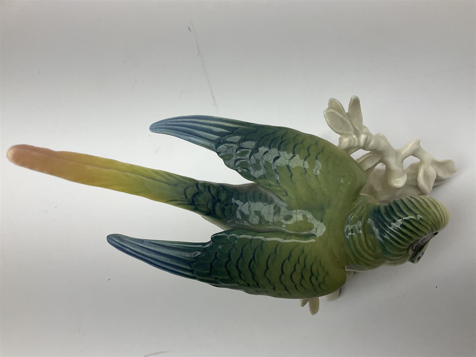 Karl Ens figure of a green woodpecker, modelled perched upon branch, model no. 7527, together with Karl Ens figure of budgie and Beswick Kingfisher no. 2371, all with printed marks beneath, tallest H25cm