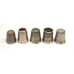 Five hallmarked silver thimbles of various sizes
