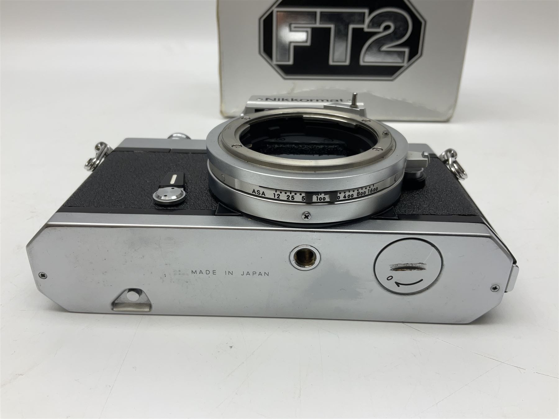 Nikkormat FT2 camera body, serial no. 5066813, in original packaging, together with Nikkormat EL camera body, serial no. 5577358, with Nikon Nikkor 50mm 1:1.8' lens no. 2143575, Nikkormat FT, serial no. 3968385, and Nikomat FT camera body, serial no. 4015491