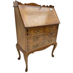 Inlaid hardwood bureau, shaped raised back over fall front inlaid with brass scrollwork, four short over one long drawer, on cabriole supports  