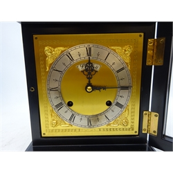  `The Golden Jubilee Clock` a William and Mary style ebonised  basket top table clock by F.W. Elliott, Croydon distributed by Garrard of London, pierced brass basket top with urn finials, signed brass dial with silvered Roman chapter, twin train movement striking the quarter hours on two gongs, Ltd.ed. 15/1000, in red velvet lined fitted case with keys, certificate and letters, H36cm, W23cm, D14cm   