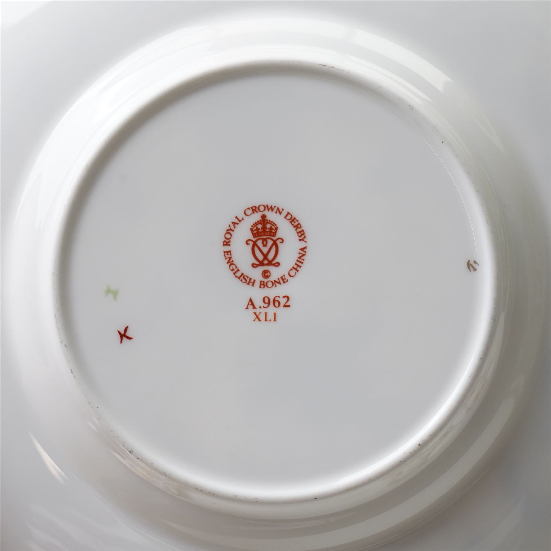 Royal Crown Derby 'Asian Rose' pattern A.962 tea service, comprising tea and coffee pots, open sucrier, milk jug, eight cups and saucers, six side plates, two serving plates, and a boxed Duck with gold stopper