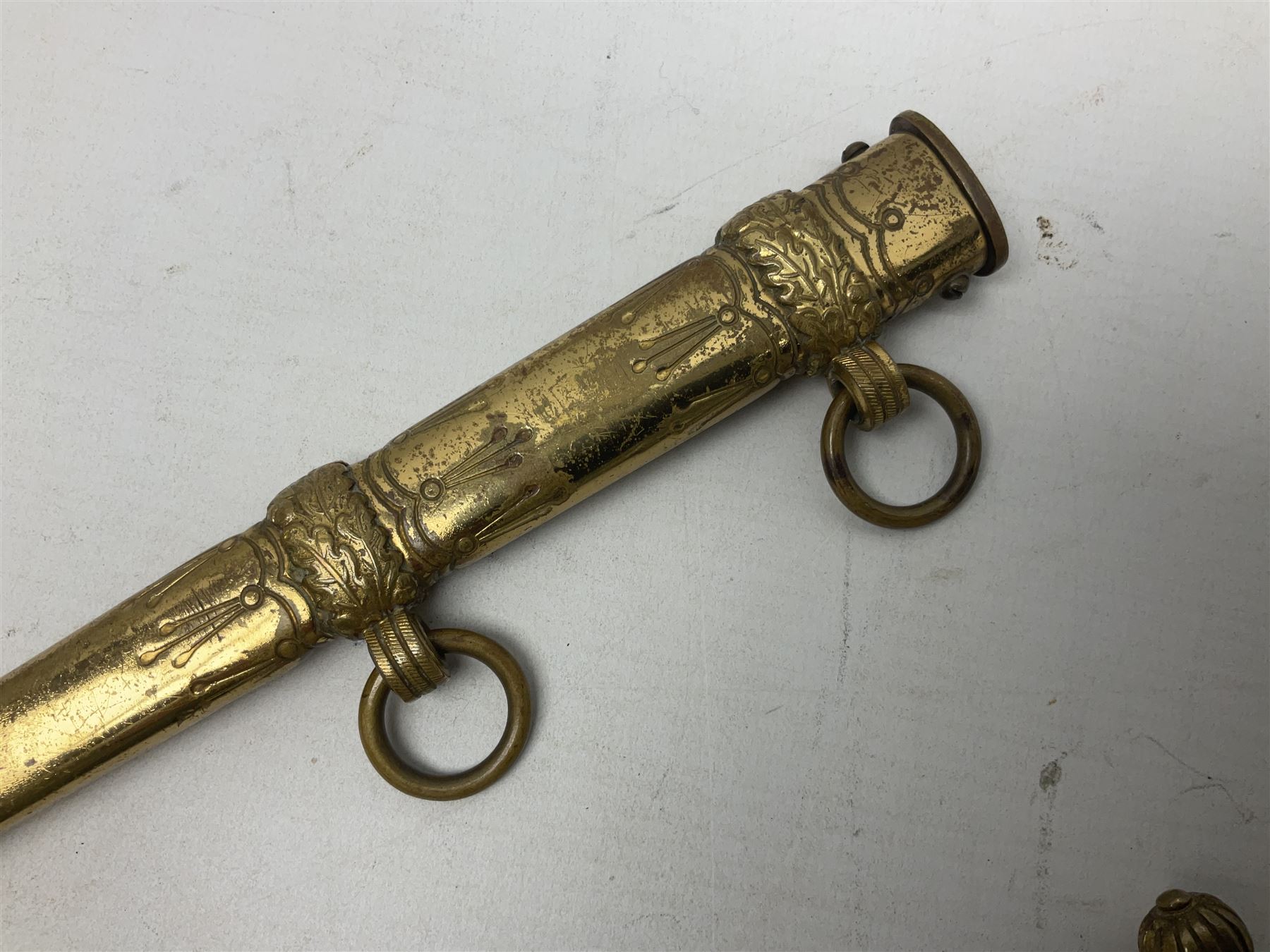 WW2 German kreigsmarine style dagger composed from various age parts, the post-war 25cm double fullered blade  with etched decoration and inscribed WKC with knight's head; in gilt brass scabbard with two rings L42cm overall