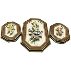 Set of three Capodimonte wall plaques, depicting floral decoration in octagonal frames with gilt edging, largest plaque H48, two small plaques H31cm.    