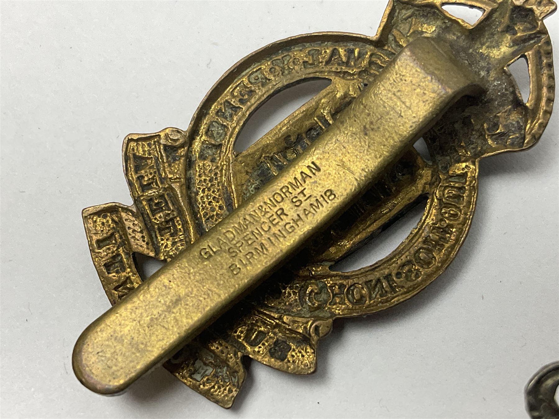 Twenty cap badges including Hertfordshire, Royal Sussex, Cambridgeshire, Hampshire, Notts and Derby, East Surrey, Herefordshire, South Lancashire, Devonshire, Bedfordshire, Durham Light Infantry etc (20)