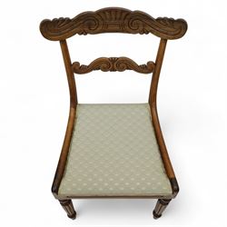 Set of four 19th-century rosewood dining chairs in the William IV style, shaped and carved top rail with fan and scroll decoration above a upholstered padded seat on reeded and turned front legs 