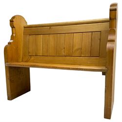 20th century waxed pine hall bench or pew, plank back over solid seat, flanked by shaped end supports