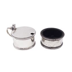 1930s silver two piece cruet set, comprising mustard pot with cover and open salt, each of circular form, with oblique gadrooned rim to top and base, hallmarked Edward Barnard & Sons Ltd, London 1939, both with blue glass liners