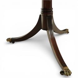 Arthur Brett & Sons - Regency design mahogany extending dining table and eight chairs, the oval top with rounded ends and two extension leaves, raised on twin pedestal supports with swept legs terminating in brass caps and castors, accompanied by a set of eight chairs comprising six single chairs and a pair of carvers, the chairs with curved backs and horizontal splat rails, upholstered seats, sabre legs and scrolling arms to the carvers
(Extends to 252cm)
(Chairs H 86cm, W 52cm)