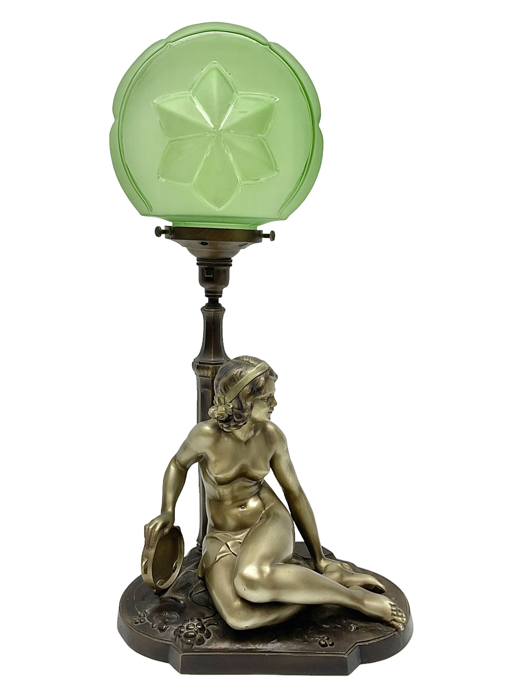 Art Deco style bronzed and gilded spelter figural table lamp with green Uranium glass shade; H48cm, another table lamp; and a bisque group