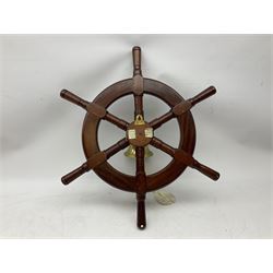 Modern six spoke ships wheel with brass bell