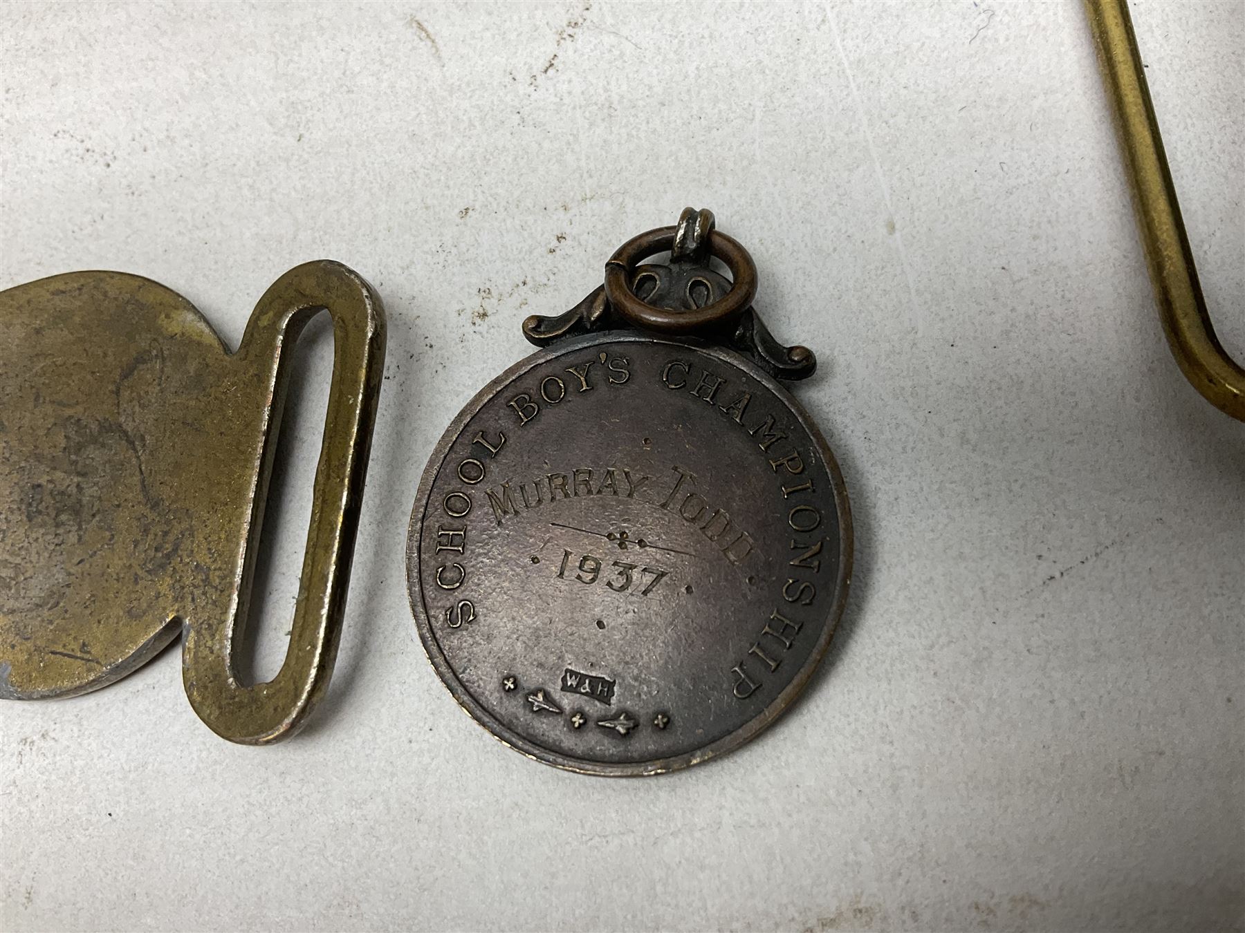 Miscellaneous militaria including two Royal Artillery and one Royal Horse Artillery stable belts; Northamptonshire Regiment trench art brass shell case lighter; unused Matchless Fire-Set; pocket knives and multi-tool; lanyards; oak shield with York & Lancaster crest etc