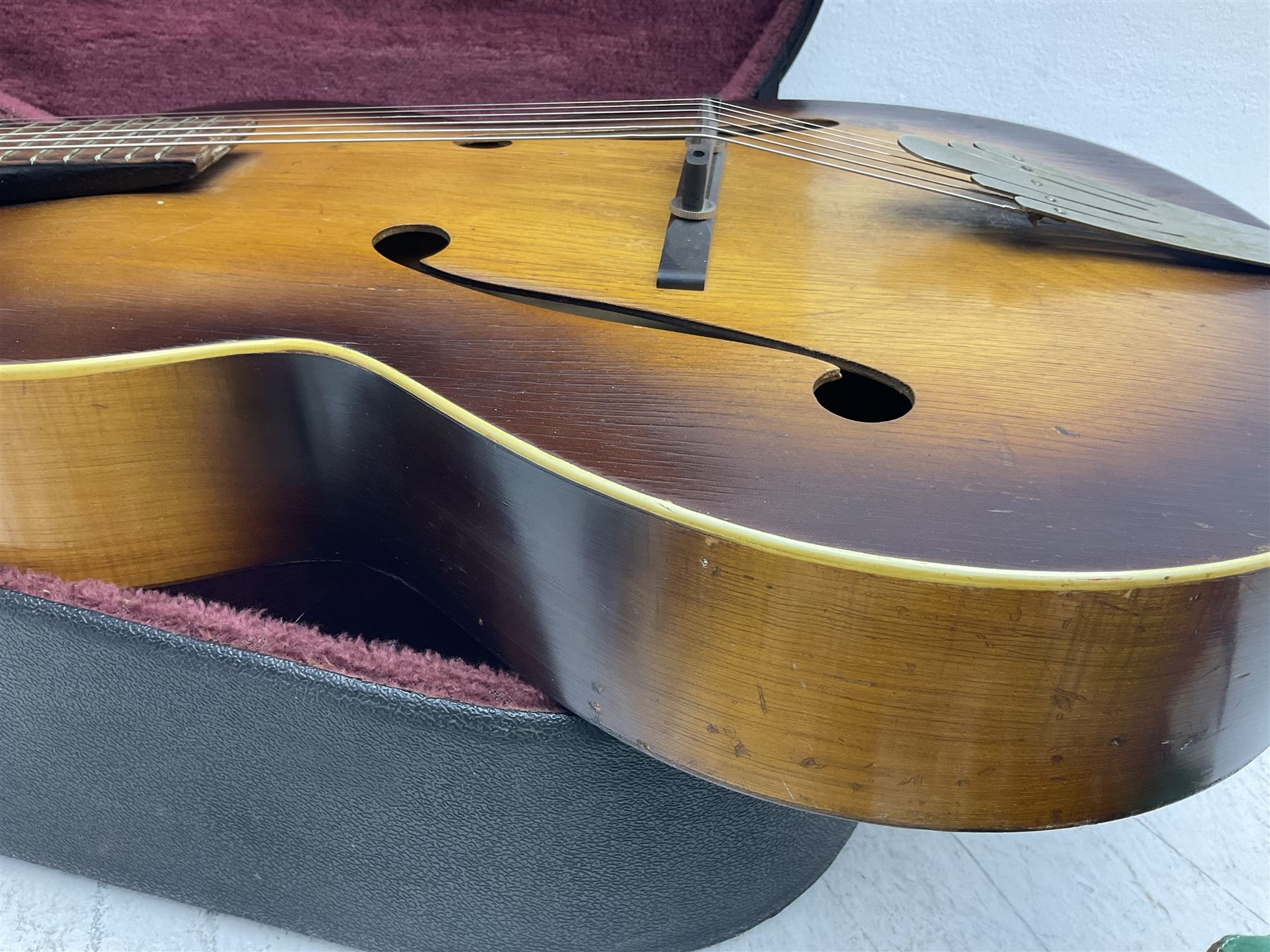 1950s Framus arch top acoustic guitar with sunburst finish and Framus logo to top, No.1937 L104cm; in hard carry case.