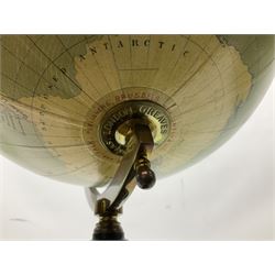 Terrestrial globe by Grinell, Washington, mounted on a brass half meridian and raised on turned wood pedestal base, H55cm