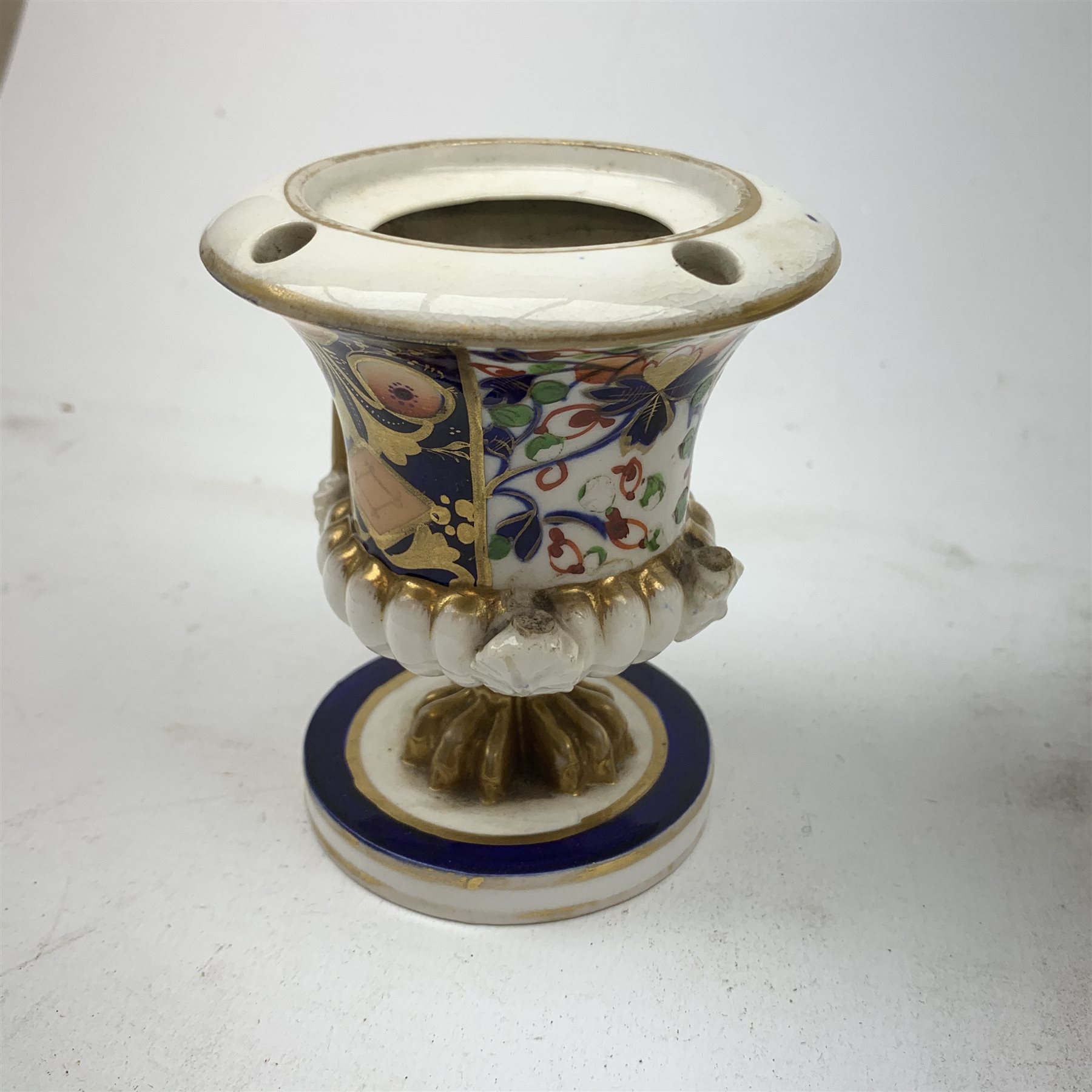 Three Bloor Derby Imari pattern twin handle urms, two examples with covers, each with mark beneath, H12cm, (all a/f), together with a pair of late 19th century Royal Crown Derby Imari pattern urns and covers, each with mark beneath, H13cm, (one significantly a/f). 