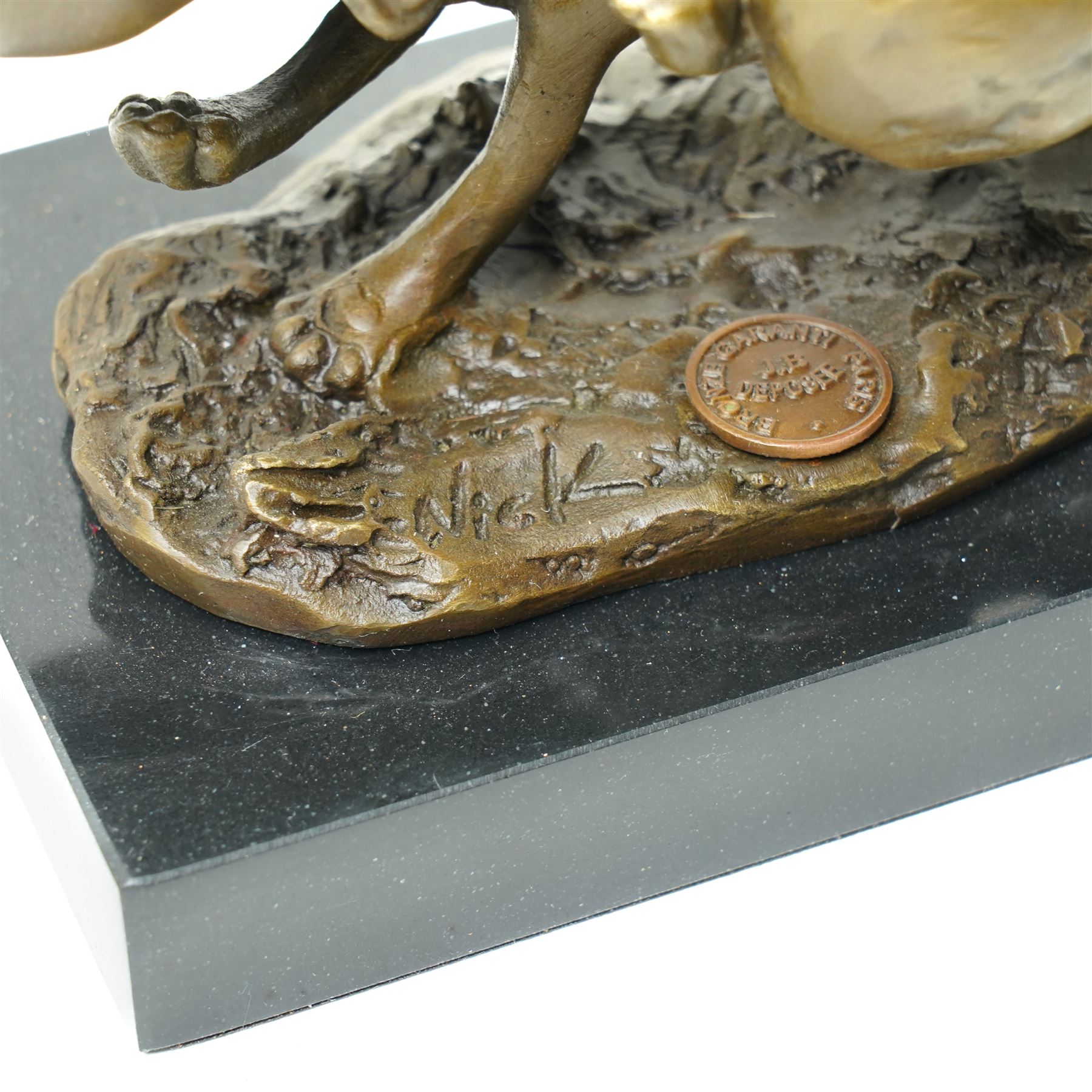 Bronze figure group, modelled as two hares in chase, after 'Nick', with foundry mark, upon a rectangular base, H11cm L15cm