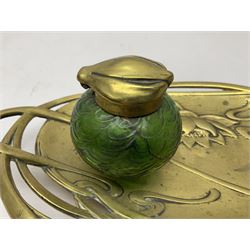 Art Nouveau Geschutzt brass desk stand, with stylised whiplash relief decoration, with removable Loetz style green glass inkwell, stamped to the base, H8cm