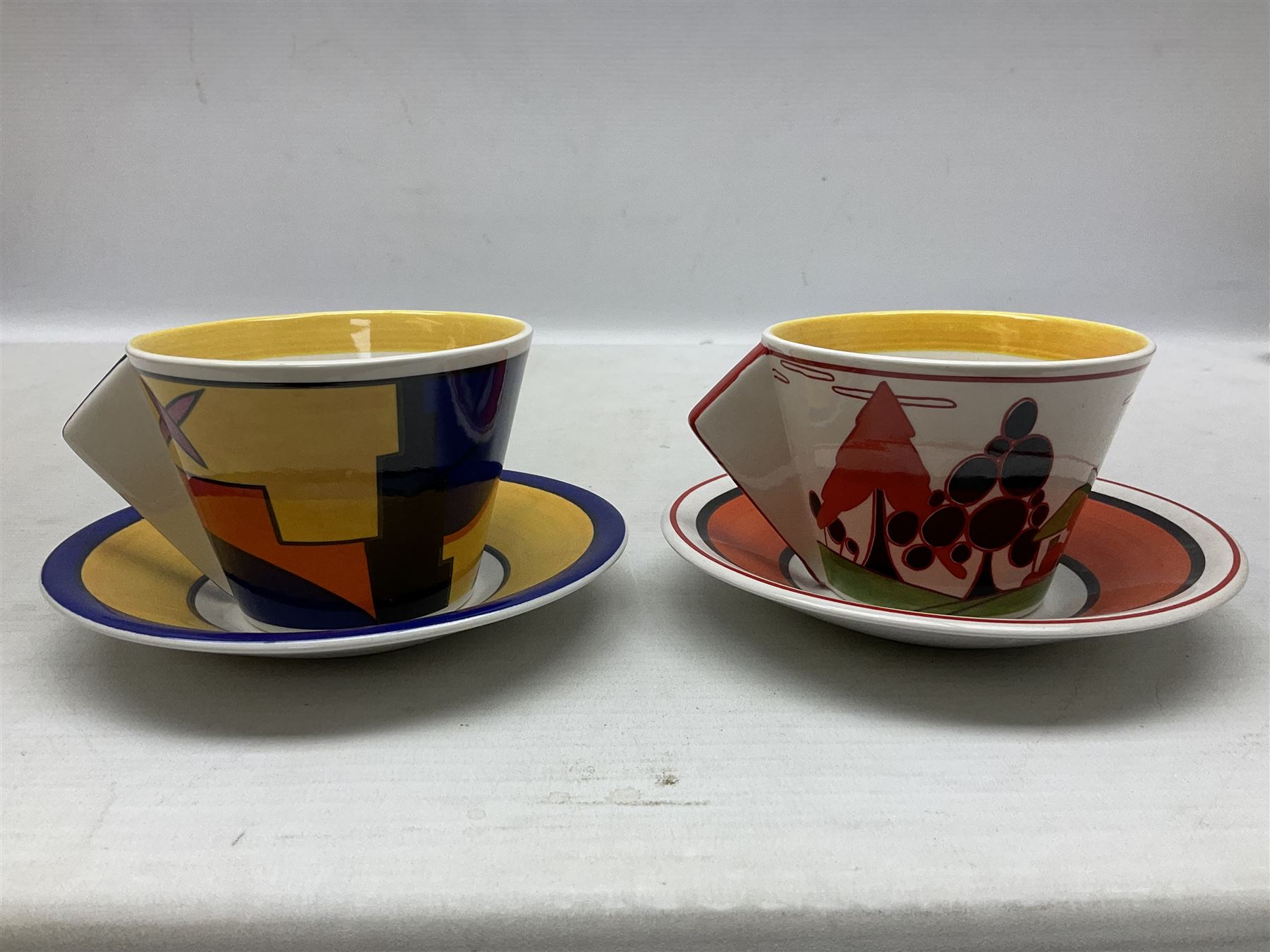 Wedgwood limited edition Clarice Cliff Design Taking Tea collection, comprising eight cups and saucers Honolulu, Apples, Gibraltar, Lilac Crocus, Trees and House, Coral Firs, Devon, and Sunray, with certificates of authenticity 