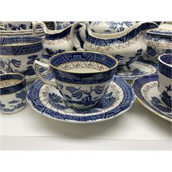 Booths Real Old Willow pattern part tea and dinner service, to include two meat platters, cake stand, teapot, two jugs, sugar bowl, sauce boat, teacups and saucers and a collection of plates and bowls